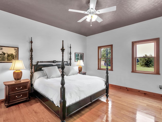 bedroom featuring light hardwood / wood-style flooring and ceiling fan