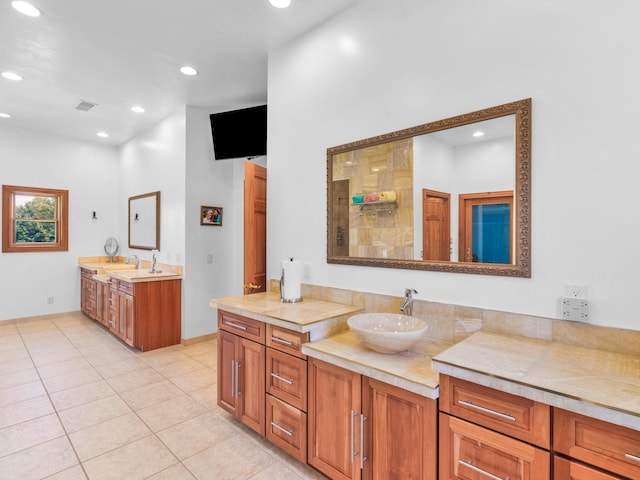 bathroom with tile patterned floors and vanity