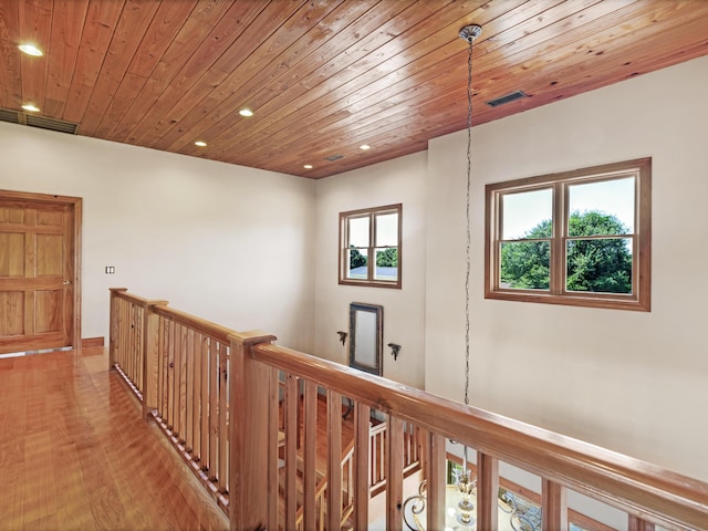 hallway featuring wood ceiling and light hardwood / wood-style flooring