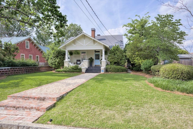 2619 Raymond Ave, Augusta, GA 30904 - bungalow-style home with a porch, fence, and a front yard