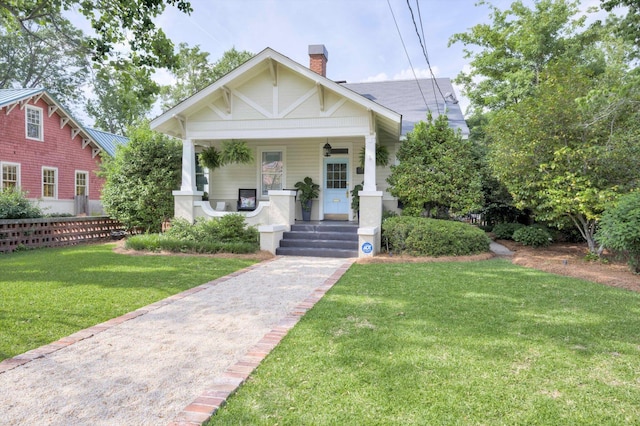 2619 Raymond Ave, Augusta, GA 30904 - bungalow featuring fence, a chimney, a porch, and a front lawn