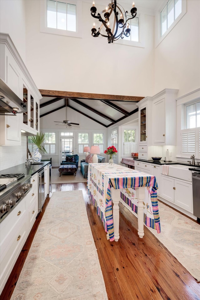 2619 Raymond Ave, Augusta, GA 30904 - kitchen with high vaulted ceiling, stainless steel gas cooktop, and dark wood-style flooring