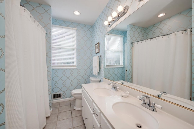 2619 Raymond Ave, Augusta, GA 30904 - bathroom featuring toilet, visible vents, a sink, and tile patterned flooring