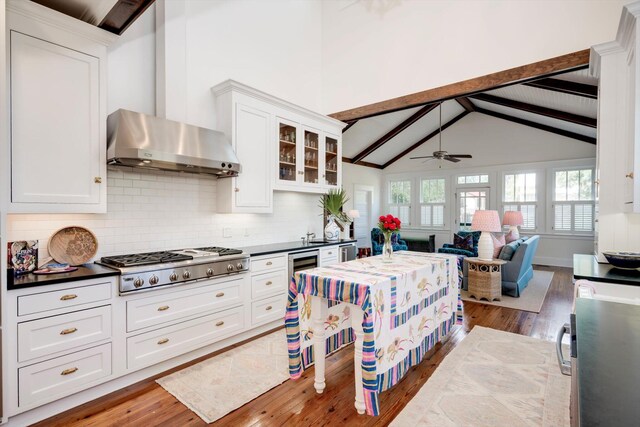2619 Raymond Ave, Augusta, GA 30904 - kitchen with ceiling fan, light wood-style floors, white cabinetry, stainless steel gas stovetop, and backsplash