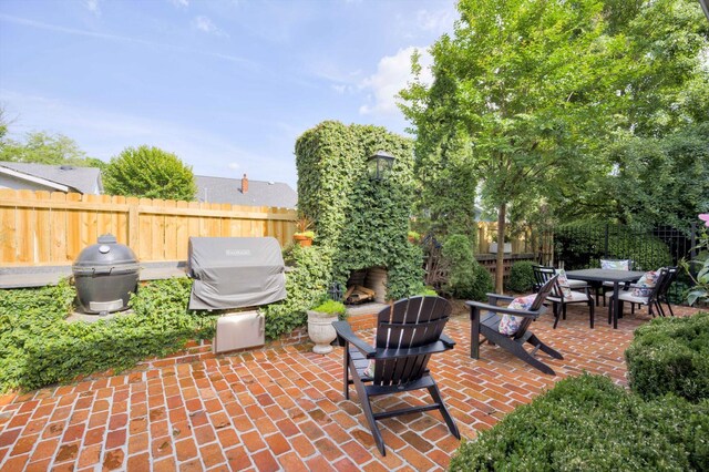 2619 Raymond Ave, Augusta, GA 30904 - view of patio featuring fence, outdoor dining area, and a grill