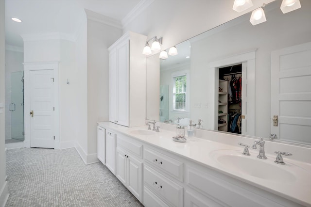 2619 Raymond Ave, Augusta, GA 30904 - bathroom with a walk in closet, ornamental molding, a shower stall, and a sink