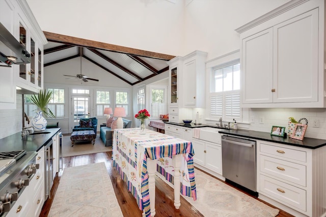 2619 Raymond Ave, Augusta, GA 30904 - kitchen with beam ceiling, a sink, stainless steel appliances, a ceiling fan, and wood finished floors