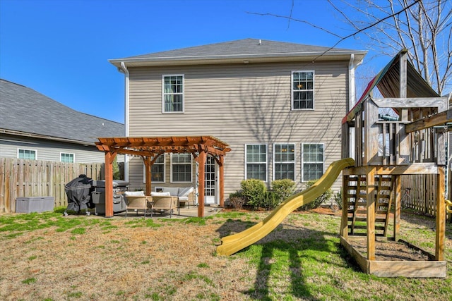 back of property with a yard, a pergola, a playground, and a patio