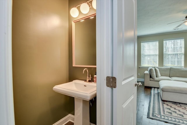 bathroom featuring ceiling fan and hardwood / wood-style floors