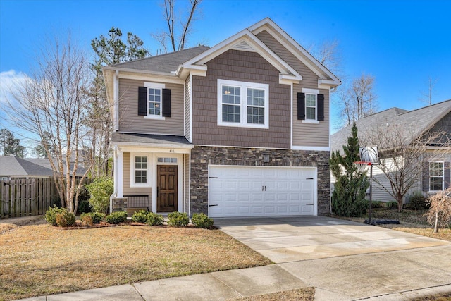 view of front of property with a garage and a front lawn