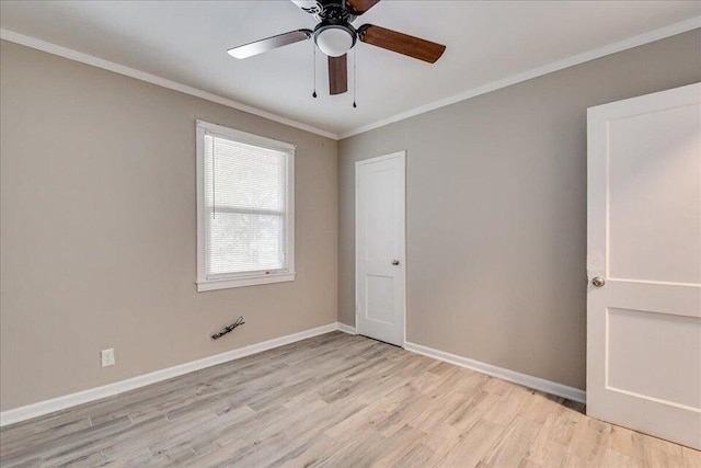 spare room featuring crown molding, ceiling fan, and light wood-type flooring