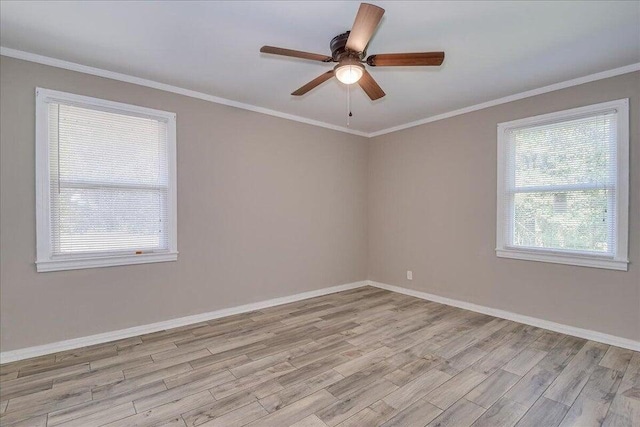 empty room featuring ceiling fan, ornamental molding, and light wood-type flooring