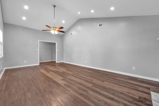 spare room with recessed lighting, a ceiling fan, dark wood-type flooring, baseboards, and high vaulted ceiling