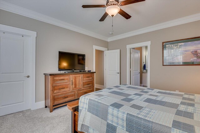 bedroom with ceiling fan, crown molding, and light carpet