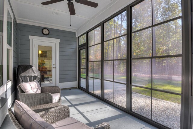 sunroom featuring ceiling fan