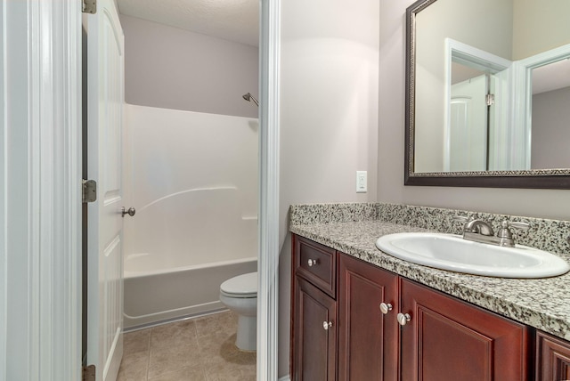 full bathroom featuring tile patterned floors, vanity, toilet, and  shower combination