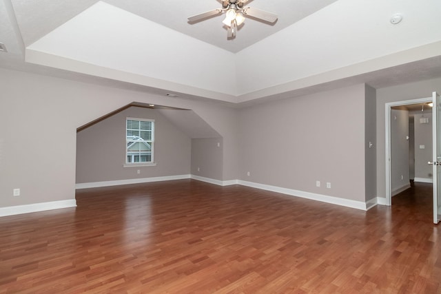 additional living space with vaulted ceiling, ceiling fan, and dark hardwood / wood-style floors