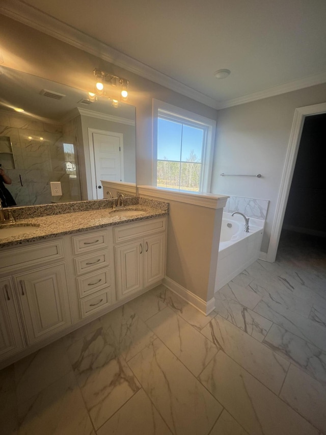 bathroom with crown molding, marble finish floor, a sink, and a bath