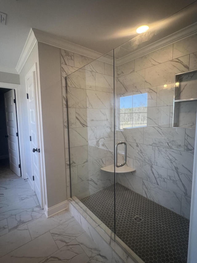 full bath featuring visible vents, baseboards, marble finish floor, a shower stall, and crown molding