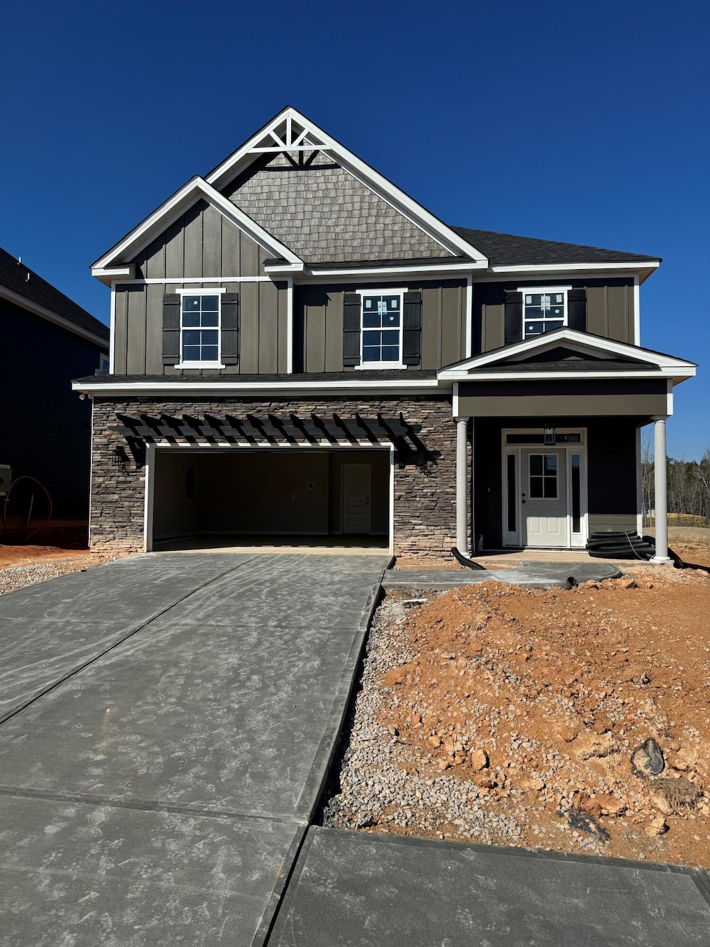 view of front of house featuring a garage and a porch