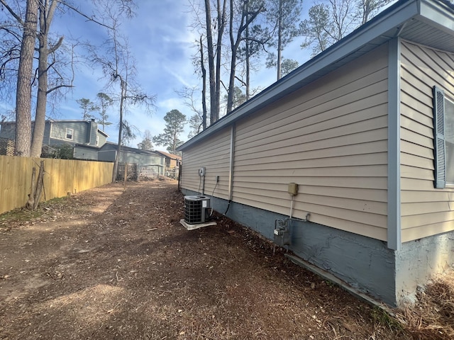 view of side of home featuring central air condition unit