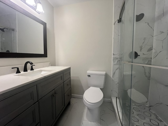 bathroom with vanity, an enclosed shower, and toilet