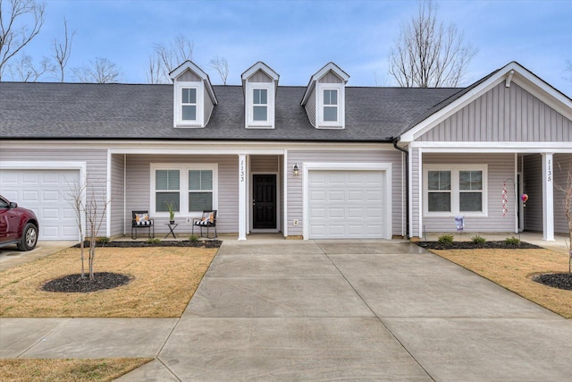 view of front of home with a porch, an attached garage, concrete driveway, roof with shingles, and board and batten siding