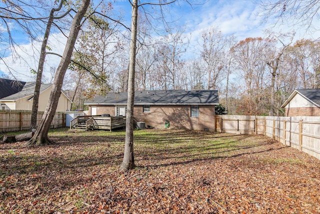 rear view of house with a wooden deck