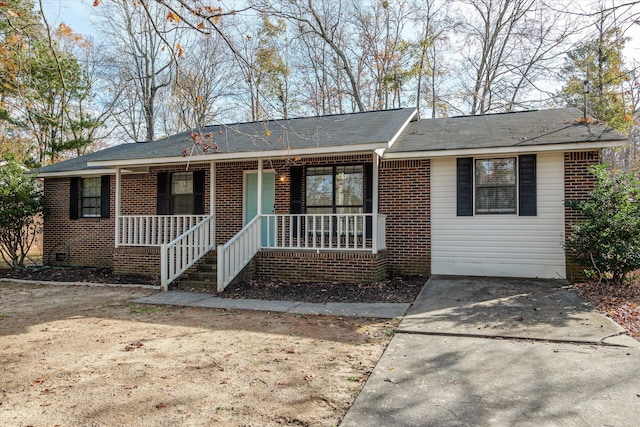 ranch-style house with covered porch