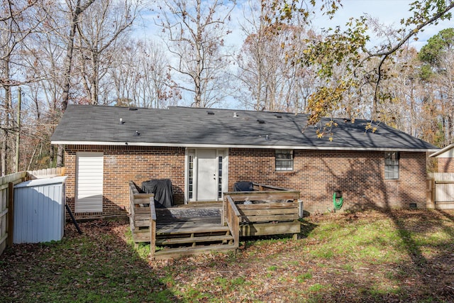 rear view of property with a deck