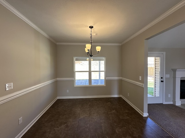 unfurnished room with crown molding, plenty of natural light, and a chandelier