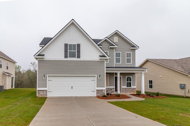 craftsman house with central air condition unit, a front lawn, and a garage