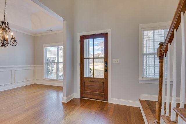 524 Jutland Way, Evans, GA 30809 - foyer featuring a chandelier, wood finished floors, ornamental molding, and stairs