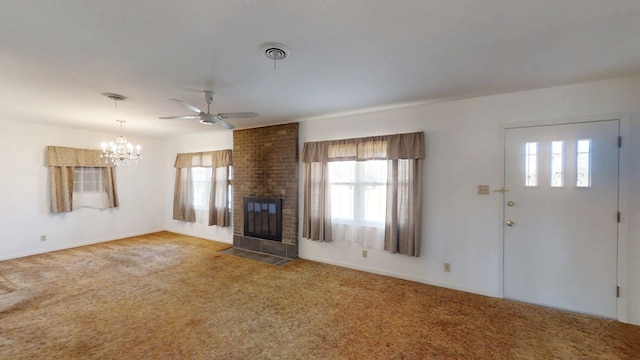 unfurnished living room with visible vents, carpet, a healthy amount of sunlight, and a fireplace