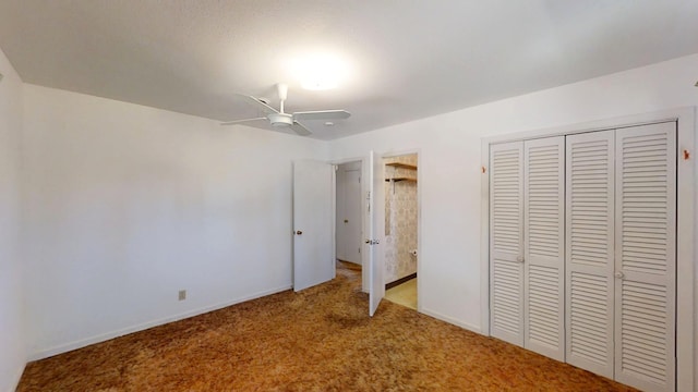 unfurnished bedroom featuring a ceiling fan, baseboards, a closet, and light carpet