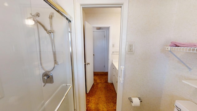 full bathroom with toilet and walk in shower