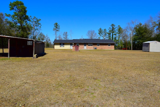 exterior space with a storage shed and an outdoor structure