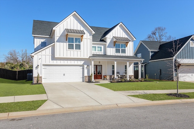 2628 Laurens St, Grovetown, GA 30813 - modern inspired farmhouse featuring board and batten siding, covered porch, cooling unit, concrete driveway, and roof with shingles