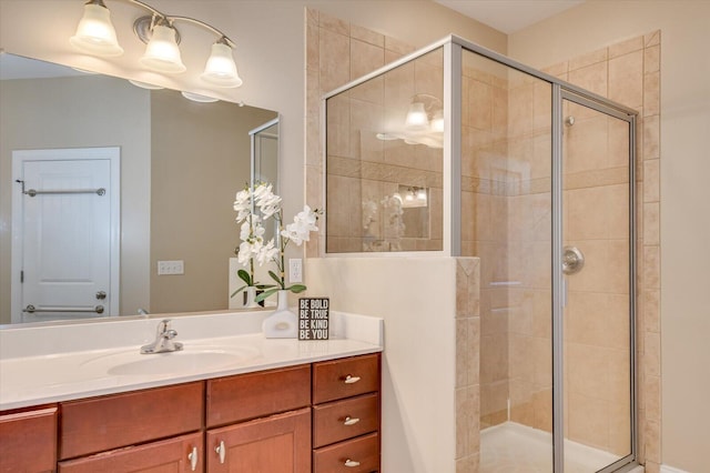 bathroom featuring vanity and a shower stall