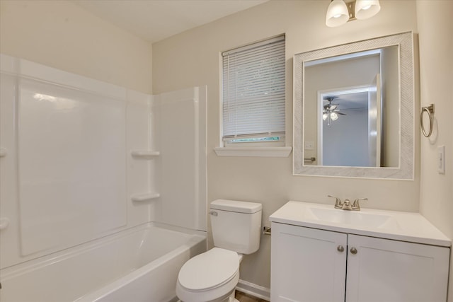 bathroom featuring toilet, vanity, ceiling fan, and bathtub / shower combination