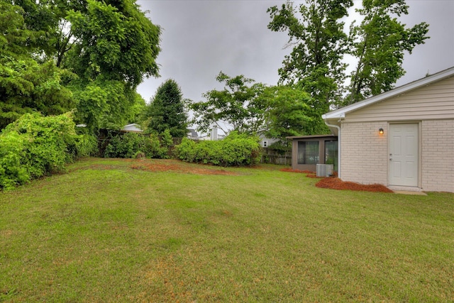 view of yard with a sunroom