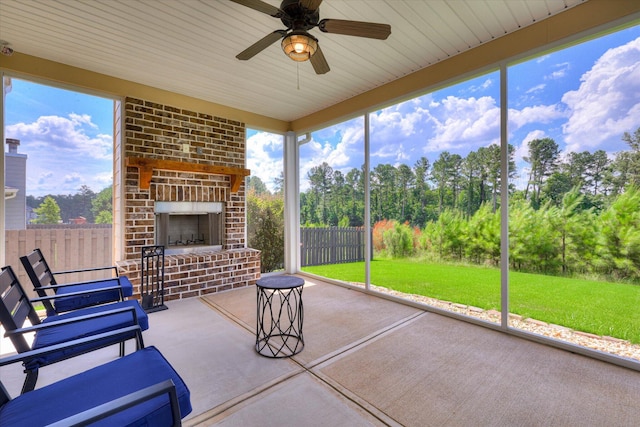 1856 Preservation Cir, Evans, GA 30809 - sunroom / solarium featuring a brick fireplace, a ceiling fan, and healthy amount of natural light