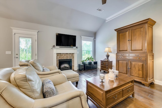 1856 Preservation Cir, Evans, GA 30809 - living room with dark wood-style flooring, a brick fireplace, and vaulted ceiling