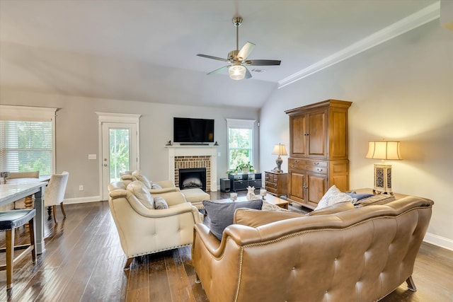 1856 Preservation Cir, Evans, GA 30809 - living room featuring a fireplace, ceiling fan, dark wood finished floors, plenty of natural light, and vaulted ceiling