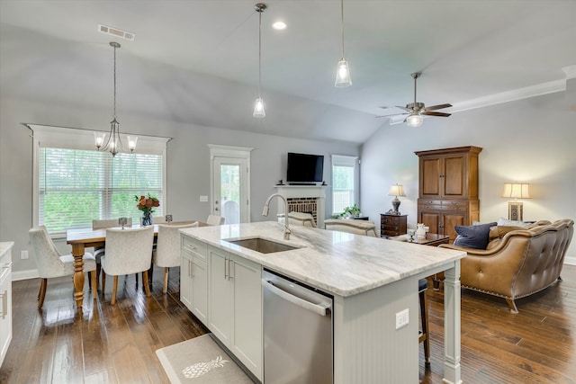 1856 Preservation Cir, Evans, GA 30809 - kitchen featuring dishwasher, open floor plan, lofted ceiling, a fireplace, and dark wood-type flooring