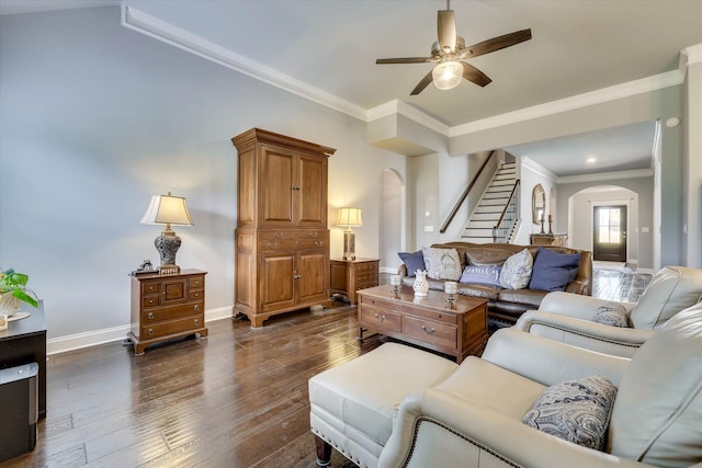 1856 Preservation Cir, Evans, GA 30809 - living room featuring arched walkways, stairway, dark wood-style flooring, a ceiling fan, and ornamental molding