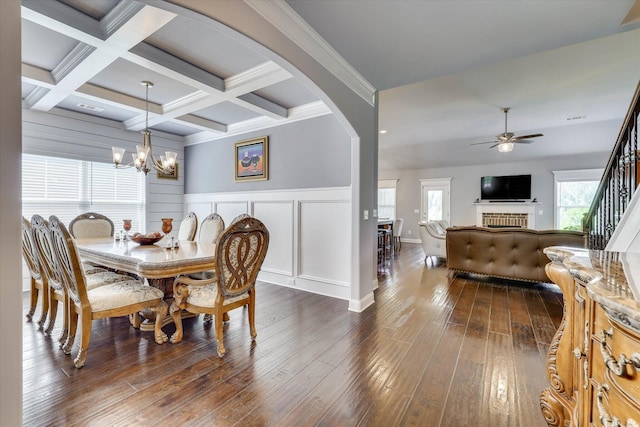 1856 Preservation Cir, Evans, GA 30809 - dining area featuring ceiling fan, beamed ceiling, a chandelier, dark wood-style flooring, and arched walkways