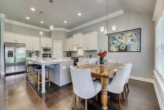 1856 Preservation Cir, Evans, GA 30809 - dining space featuring a chandelier, dark wood-type flooring, crown molding, and recessed lighting