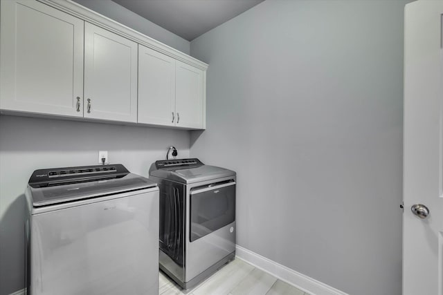 1856 Preservation Cir, Evans, GA 30809 - laundry area with washing machine and clothes dryer, cabinet space, and light wood-style flooring