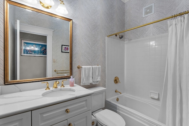 bathroom with toilet, shower / tub combo, visible vents, and vanity